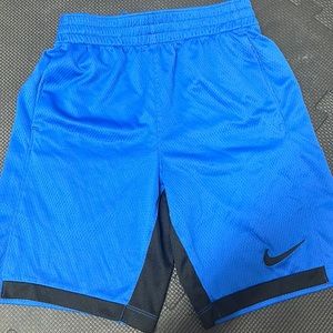 Blue Nike shorts.